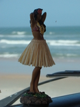 Hula girl on the dash of a VW Bus at the beach